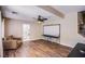 Spacious bonus room with wood flooring, ceiling fan, and access to kitchen at 1508 Silver Knoll Ave, Las Vegas, NV 89123