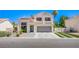 Attractive two-story home featuring a spacious driveway and a landscaped front yard at 1508 Silver Knoll Ave, Las Vegas, NV 89123