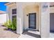 Inviting front entrance featuring a secure door, decorative trim, and desert landscaping at 1508 Silver Knoll Ave, Las Vegas, NV 89123