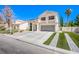 Beautiful two-story home featuring a spacious driveway and landscaped front yard at 1508 Silver Knoll Ave, Las Vegas, NV 89123
