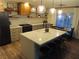 Well-lit kitchen boasts an island with seating, modern appliances, and decorative pendant lights at 1508 Silver Knoll Ave, Las Vegas, NV 89123