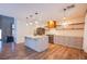 Bright, open kitchen featuring an island, modern fixtures, and stainless steel appliances at 1508 Silver Knoll Ave, Las Vegas, NV 89123