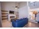 Bright living room with fireplace, built-in shelving, and a comfortable blue sofa at 1508 Silver Knoll Ave, Las Vegas, NV 89123