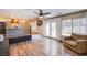 Open floor plan living area with kitchen, living room and a comfortable armchair at 1508 Silver Knoll Ave, Las Vegas, NV 89123