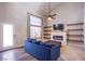 Cozy living room features a fireplace, open shelving and large bright window at 1508 Silver Knoll Ave, Las Vegas, NV 89123