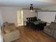 Living room featuring hardwood floors, an office, and an American flag at 1508 Silver Knoll Ave, Las Vegas, NV 89123