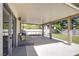 Spacious covered patio with seating, overlooking a landscaped backyard at 1508 Silver Knoll Ave, Las Vegas, NV 89123