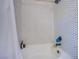 Shower with white hexagon tile and black trim at 1508 Silver Knoll Ave, Las Vegas, NV 89123