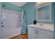 Bathroom with shower-tub combo, updated vanity, framed mirror, and stylish tile flooring at 165 Calm Morning Ave, Henderson, NV 89002