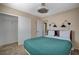 Bedroom with carpet, ceiling fan, and sconces to match bed's headboard at 165 Calm Morning Ave, Henderson, NV 89002