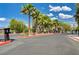 Community entrance gate with palm trees and well-maintained landscaping welcomes residents at 165 Calm Morning Ave, Henderson, NV 89002