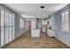 Modern kitchen featuring white cabinets, stainless steel appliances, and a center island for extra counter space at 165 Calm Morning Ave, Henderson, NV 89002
