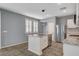 Modern kitchen features stainless appliances, granite countertops, and a central island sink at 165 Calm Morning Ave, Henderson, NV 89002