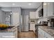 Well-equipped kitchen featuring modern appliances, granite countertops and ample cabinet space at 165 Calm Morning Ave, Henderson, NV 89002