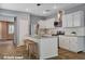 Modern kitchen featuring granite countertops, white cabinets, and stainless steel appliances at 165 Calm Morning Ave, Henderson, NV 89002