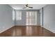 Large living area with access to the backyard featuring wood floors and neutral paint to fit any design at 165 Calm Morning Ave, Henderson, NV 89002