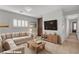 Bright living room with comfortable seating, stylish decor, and plenty of natural light at 165 Calm Morning Ave, Henderson, NV 89002