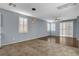 Open living room with views of the kitchen, backyard access, recessed lighting, and modern ceiling fans at 165 Calm Morning Ave, Henderson, NV 89002
