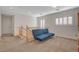 Carpeted loft with stairs, shutters, and comfortable seating at 165 Calm Morning Ave, Henderson, NV 89002