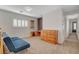 Loft space features carpet, shutters, and natural wood cabinet and desk at 165 Calm Morning Ave, Henderson, NV 89002