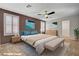 Comfortable main bedroom with a ceiling fan, soft lighting, and ample space at 165 Calm Morning Ave, Henderson, NV 89002