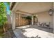 Covered patio area with pavers offers an inviting space for outdoor relaxation and entertaining at 165 Calm Morning Ave, Henderson, NV 89002