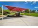 Community playground with sunshade, play equipment, and green space for to enjoy at 165 Calm Morning Ave, Henderson, NV 89002