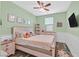 bedroom with a ceiling fan and a bed and some dressers and decor at 2104 Leatherbridge Ct, North Las Vegas, NV 89081
