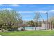 Beautiful fenced community pool with clear blue water and green landscaping at 2104 Leatherbridge Ct, North Las Vegas, NV 89081