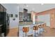 Kitchen with granite countertops, stainless appliances, pendant lighting, and stylish barstool seating at 2104 Leatherbridge Ct, North Las Vegas, NV 89081