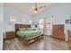 Main bedroom features ample natural light, plank flooring, ceiling fan, and neutral wall color at 2104 Leatherbridge Ct, North Las Vegas, NV 89081