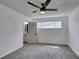 Bedroom with gray carpet leading to updated bathroom at 212 View Dr, Las Vegas, NV 89107