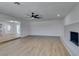 Bright, open floor plan from living room to kitchen, enhanced by modern wood-look flooring at 212 View Dr, Las Vegas, NV 89107