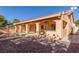 A spacious backyard with a covered patio with archways, a pool, and a brick-paved area perfect for outdoor living at 2143 Vista Famosa Ct, Las Vegas, NV 89123