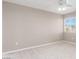 This bedroom features neutral walls, carpet flooring, a ceiling fan, and a window with horizontal blinds at 2143 Vista Famosa Ct, Las Vegas, NV 89123