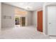 Bright bedroom with ceiling fan, sliding glass door to patio, and neutral carpet at 2143 Vista Famosa Ct, Las Vegas, NV 89123