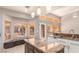 Open kitchen featuring an island, granite countertops, stainless appliances, and backyard view at 2143 Vista Famosa Ct, Las Vegas, NV 89123
