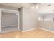 The living room has wood floors, a ceiling fan, and an open doorway to a carpeted bedroom at 2143 Vista Famosa Ct, Las Vegas, NV 89123