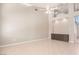 Bright living room features tall ceilings, built in shelving, and tile flooring at 2143 Vista Famosa Ct, Las Vegas, NV 89123