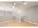 Living room with wood floors, a ceiling fan, recessed lights, and a half wall with white trim at 2143 Vista Famosa Ct, Las Vegas, NV 89123