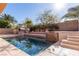 Sparkling pool featuring a waterfall feature and basketball hoop and plenty of space for outdoor entertainment and recreation at 2143 Vista Famosa Ct, Las Vegas, NV 89123