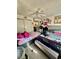 Bedroom with two beds, closet space, ceiling fan, and colorful decor for a personalized space at 221 Mission Newport Ln # 205, Las Vegas, NV 89107