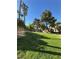 Apartment complex featuring verdant grounds, mature trees, and ample outdoor space at 221 Mission Newport Ln # 205, Las Vegas, NV 89107