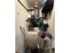 A utility area shows a stacked washer-dryer, shelf, and personal items at 221 Mission Newport Ln # 205, Las Vegas, NV 89107