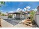 Exterior view of a backyard with covered patio and rock landscaping at 2377 Los Feliz St, Las Vegas, NV 89156