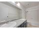 Bathroom featuring double sinks, gray cabinetry, and a tiled shower/tub combo at 2377 Los Feliz St, Las Vegas, NV 89156