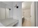 Bathroom with a tiled shower/tub combo, vanity and a separate make up vanity at 2377 Los Feliz St, Las Vegas, NV 89156
