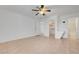 Spacious bedroom featuring a ceiling fan, closet and a vanity area leading to bathroom at 2377 Los Feliz St, Las Vegas, NV 89156