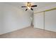 This bedroom features tile flooring, ceiling fan, and closet at 2377 Los Feliz St, Las Vegas, NV 89156