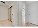 Bedroom with tiled floor and closet with mirrored doors, offering style and functionality at 2377 Los Feliz St, Las Vegas, NV 89156